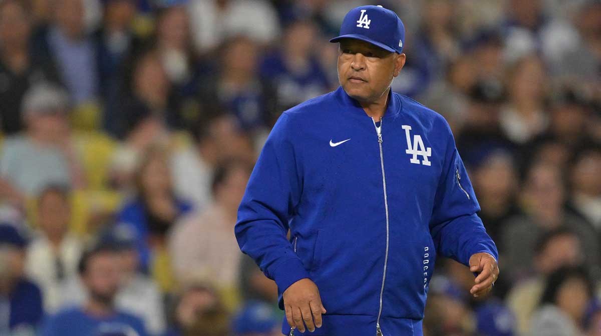 Los Angeles Dodgers manager Dave Roberts (30) walks on the field for a pitching change against the Minnesota Twins at Dodger Stadium. Dodgers manager Dave Roberts teases Shohei Ohtani 'approach' that could tie MLB HR record.