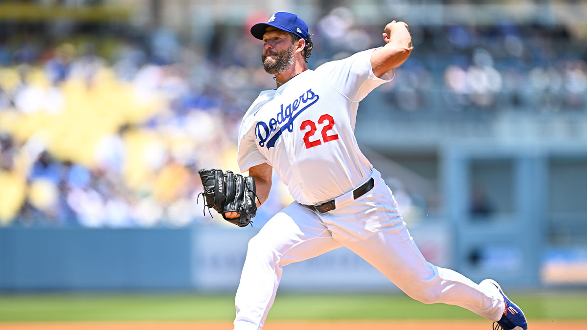 Los Angeles Dodgers starting pitcher Clayton Kershaw (22) throws a pitch against the Milwaukee Brewers during the first inning of the game at Dodger Stadium.