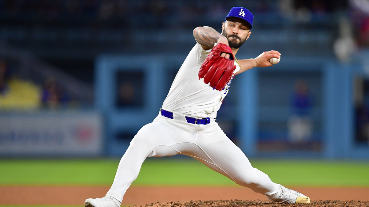Dodgers pitcher Tanner Scott (66) throws
