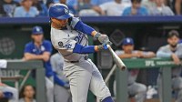 Los Angeles Dodgers shortstop Mookie Betts (50) singles in a run in the fifth inning against the Kansas City Royals at Kauffman Stadium.