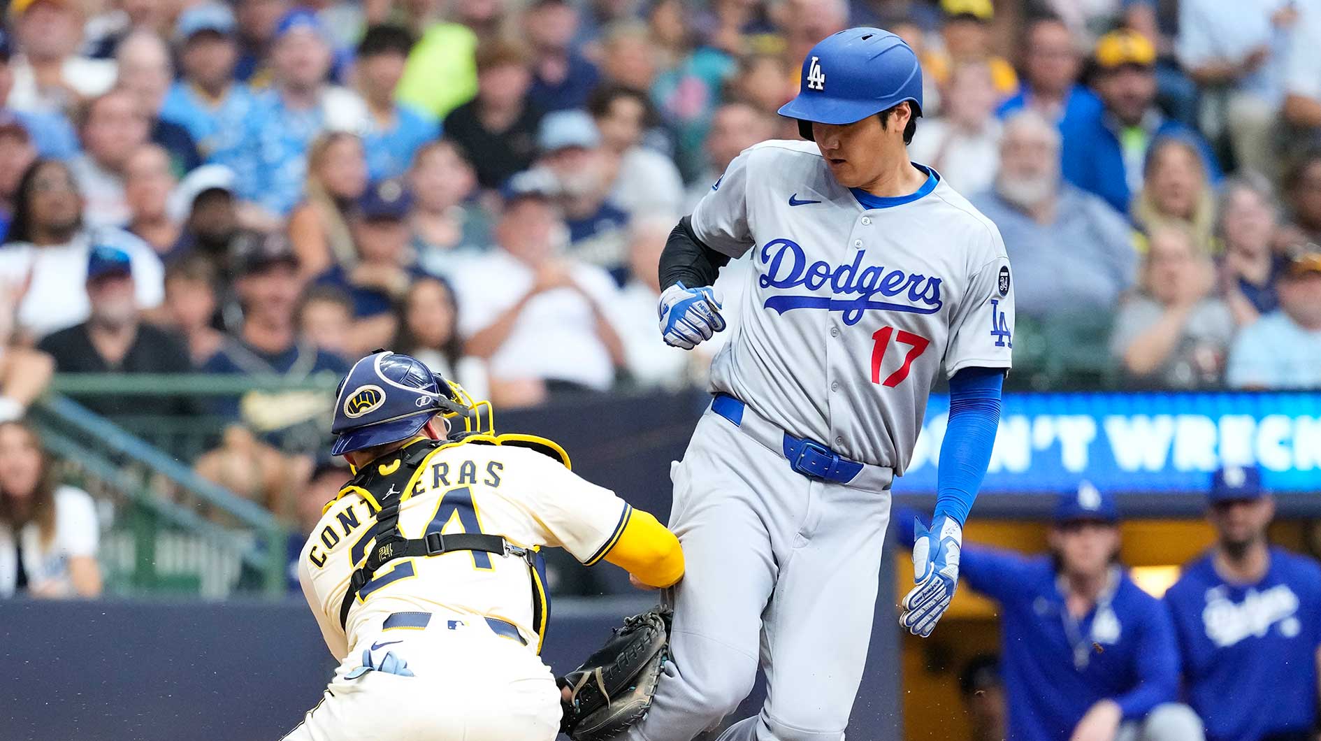Los Angeles Dodgers designated hitter Shohei Ohtani (17) is tagged out by Milwaukee Brewers catcher William Contreras (24) during the sixth inning at American Family Field. Ohtani praised Jacob Misiorowski after the game.