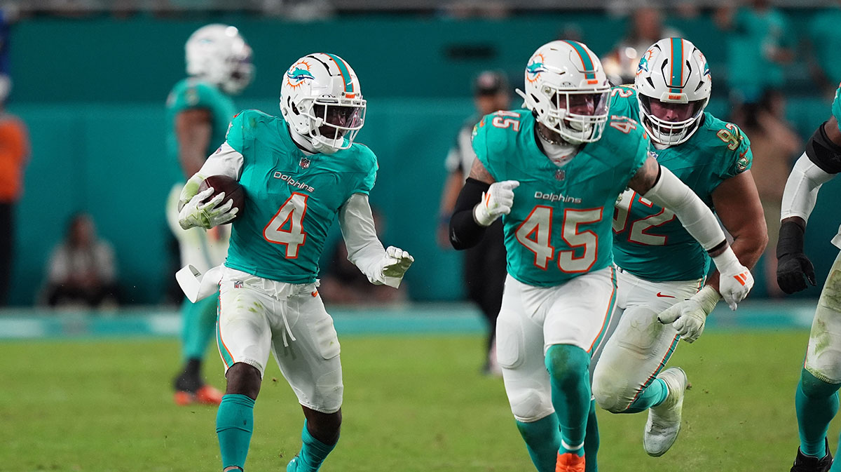 Miami Dolphins cornerback Kader Kohou (4) runs with the ball after intercepting a pass from San Francisco 49ers quarterback Brock Purdy (13, not pictured) during second half at Hard Rock Stadium.