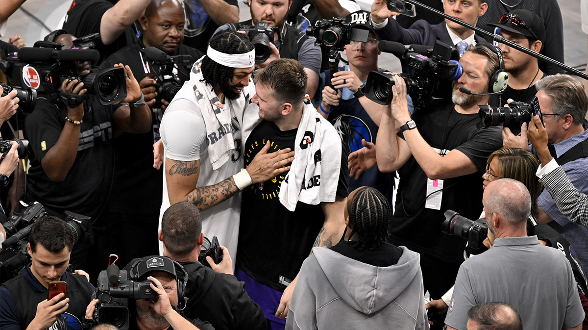 Dallas Mavericks forward Anthony Davis (3) talks with Los Angeles Lakers guard Luka Doncic (77) after the game at the American Airlines Center.