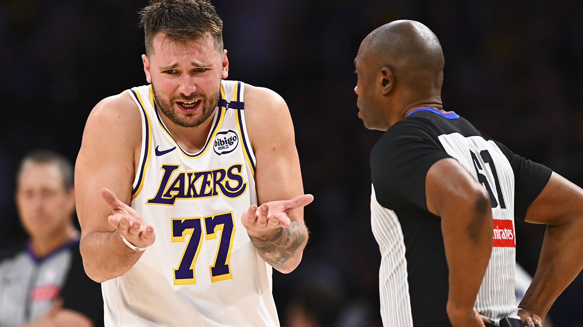 Los Angeles Lakers guard Luka Doncic (77) reacts to a call from referee Courtney Kirkland (61) against the Chicago Bulls during the second half at Crypto.com Arena.