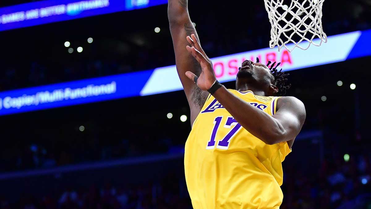 Los Angeles Lakers forward Dorian Finney-Smith (17) scoes the basket ahead of Minnesota Timberwolves guard Anthony Edwards (5) during the first half in game five of first round for the 2025 NBA Playoffs at Crypto.com Arena.