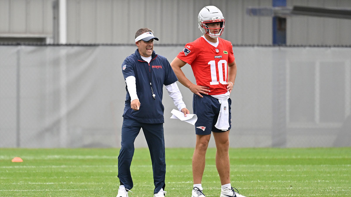 New England Patriots offensive coordinator Josh McDaniels directs a drill for quarterback Drake Maye (10) during minicamp at Gillette Stadium.