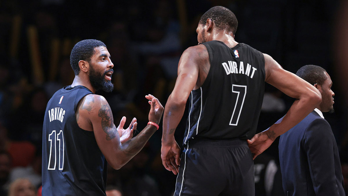 Brooklyn Nets guard Kyrie Irving (11) talks with forward Kevin Durant (7) during the second half against the Indiana Pacers at Barclays Center.