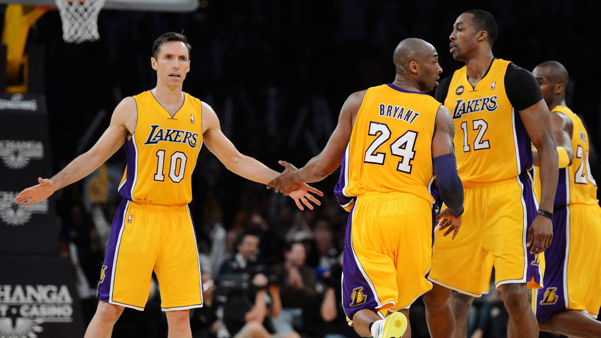Los Angeles Lakers point guard Steve Nash (10), shooting guard Kobe Bryant (24) and center Dwight Howard (12) react in the second half of the game against the Washington Wizards at the Staples Center. Wizards won 103-100.