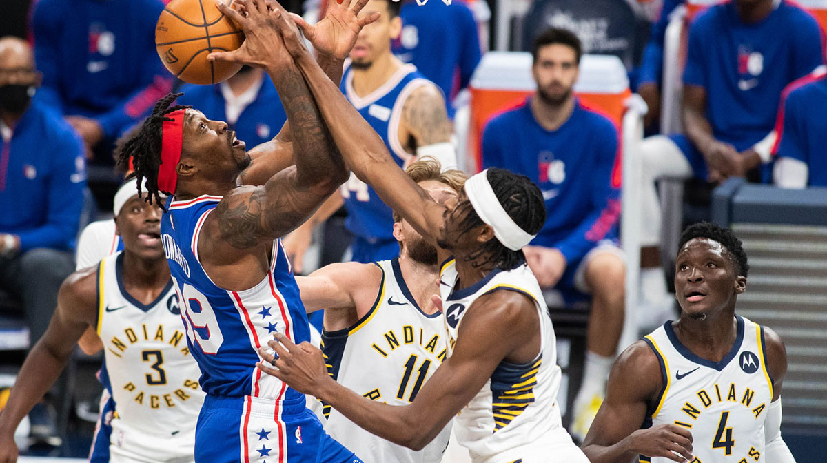 Philadelphia 76ers center Dwight Howard (39) shoots while Indiana Pacers forward Justin Holiday (8) defends in the first quarter at Bankers Life Fieldhouse.
