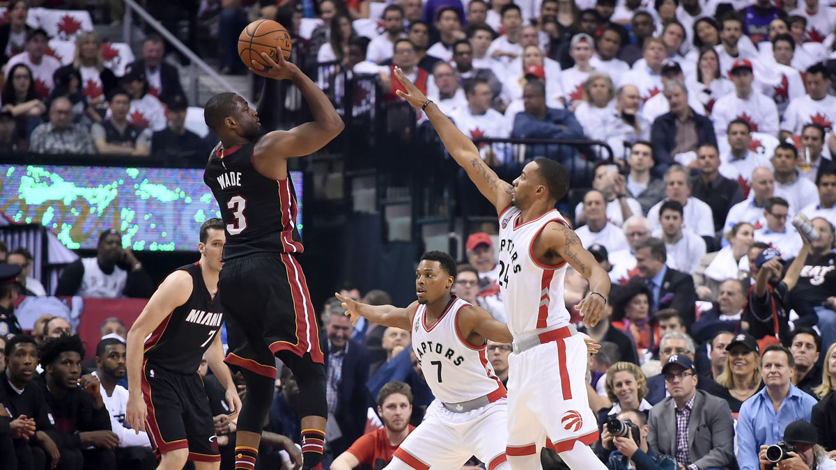 Miami Heat guard Dwyane Wade (3) takes a shot over Toronto Raptors guards Norman Powell (24) and Kyle Lowry (7) in game one of the second round of the NBA Playoffs at Air Canada Centre.