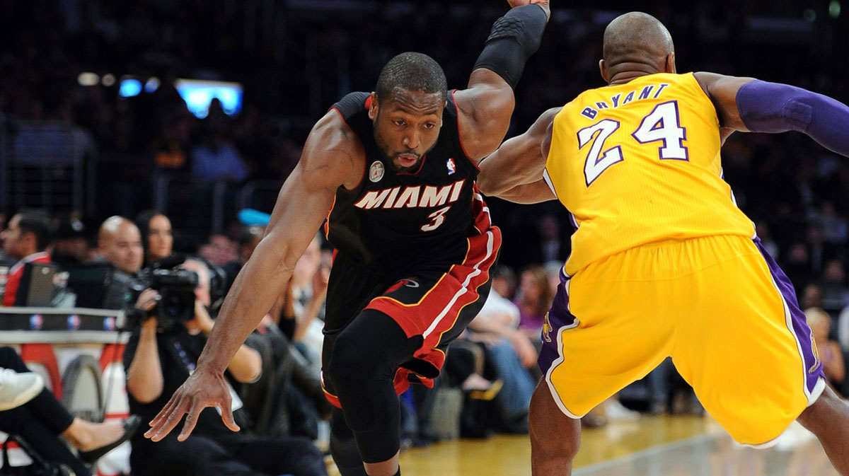 Los Angeles Lakers shooting guard Kobe Bryant (24) fouls Miami Heat shooting guard Dwyane Wade (3) in the first quarter at the Staples Center.