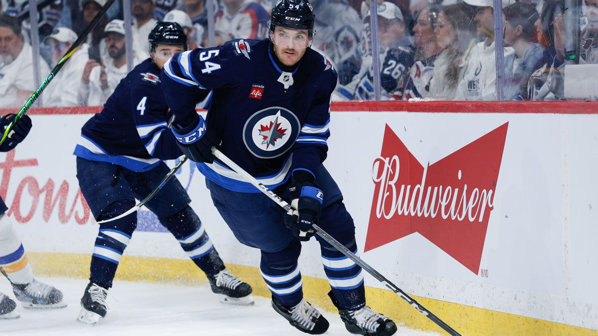 Winnipeg Jets defenseman Dylan Samberg (54) looks to make a pass against St. Louis Blues during the first period in game one of the first round of the 2025 Stanley Cup Playoffs at Canada Life Centre.