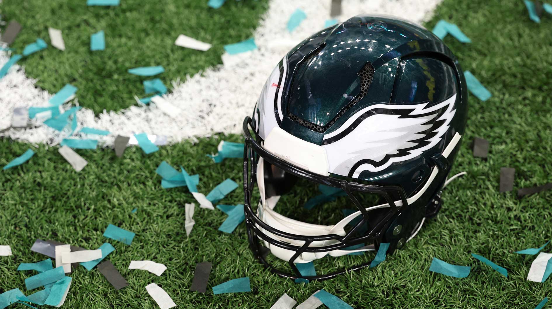 A Philadelphia Eagles player's helmet rests on the field after Super Bowl LIX against the Kansas City Chiefs