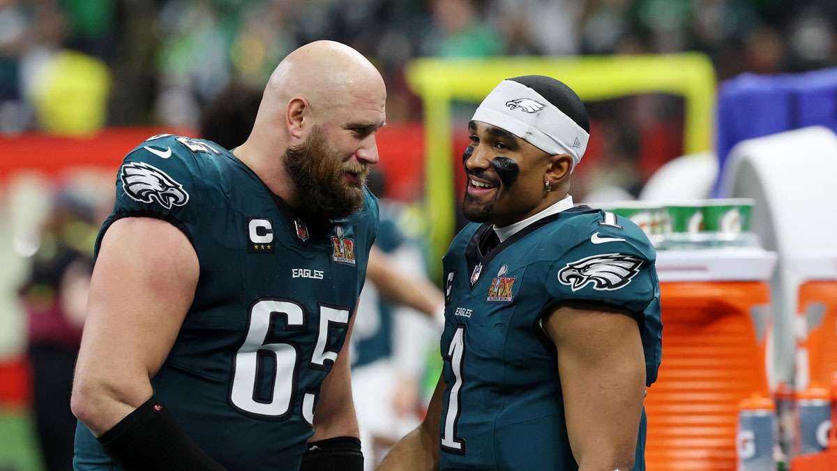 Philadelphia Eagles offensive tackle Lane Johnson (65) shakes hands with quarterback Jalen Hurts (1) during the second half of Super Bowl LIX at Caesars Superdome.