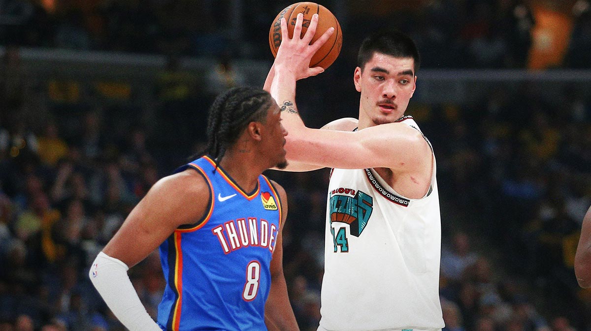 Memphis Grizzlies center Zach Edey (14) handles the as Oklahoma City Thunder forward Jalen Williams (8) defends during the second quarter during game three for the first round of the 2024 NBA Playoffs at FedExForum.