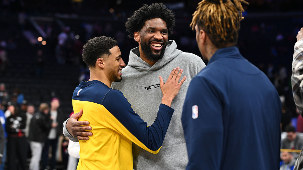 Indiana Pacers guard Tyrese Haliburton (0) reacts with Philadelphia 76ers center Joel Embiid (21) after the game at Wells Fargo Center.