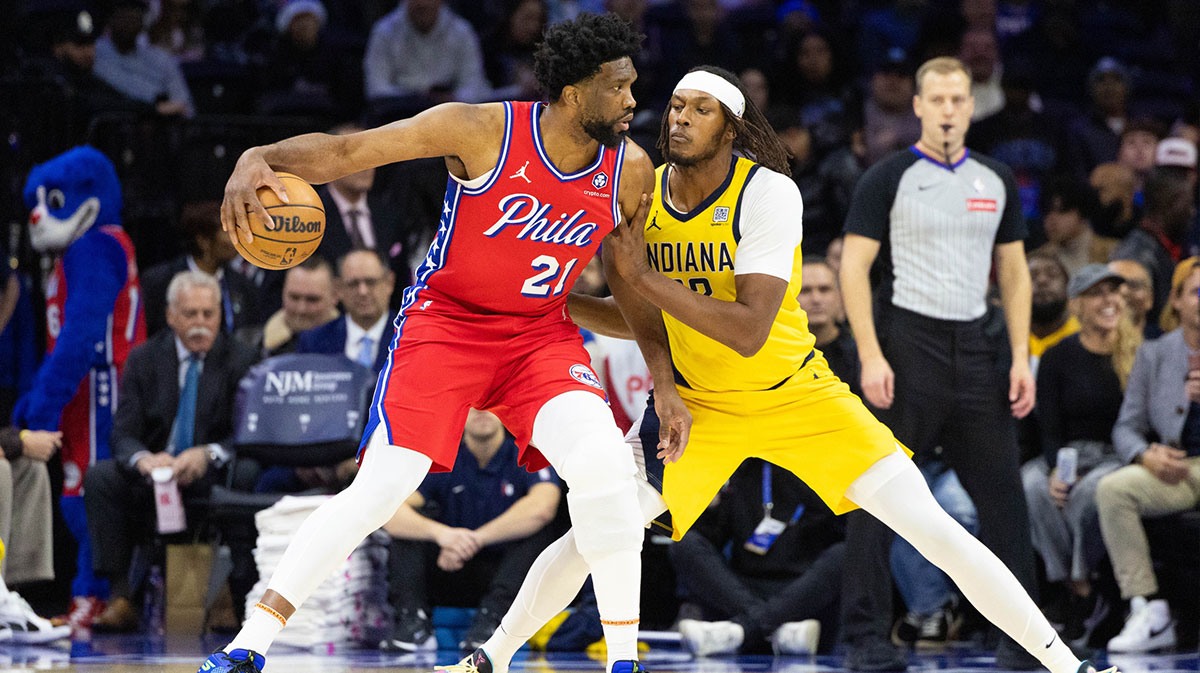 Philadelphia 76ers center Joel Embiid (21) controls the ball against Indiana Pacers center Myles Turner (33) during the first quarter at Wells Fargo Center.