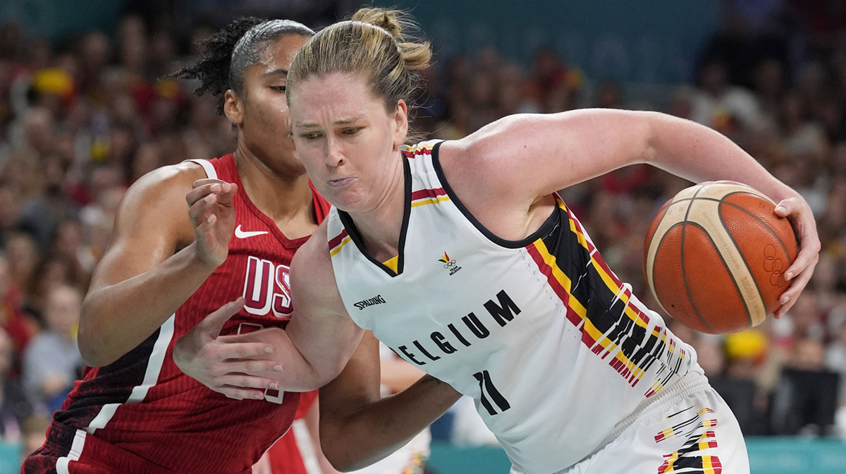 Belgium power forward Emma Meesseman (11) controls the ball against United States power forward Alyssa Thomas (14) in the second half in a women’s group stage game during the Paris 2024 Olympic Summer Games at Stade Pierre-Mauroy.
