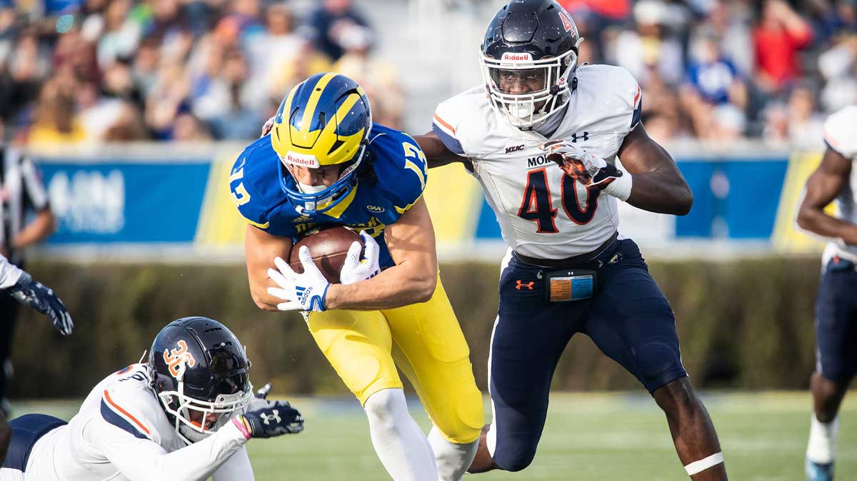 Delaware Blue Hens wide receiver Brett Buckman (13) picks up 20 yards against the Morgan State Bears linebacker Erick Hunter (40)