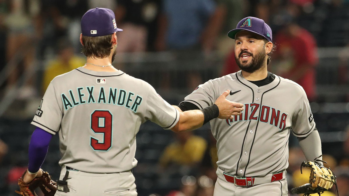 Arizona Diamondbacks third baseman Blaze Alexander (9) and first baseman Eugenio Suarez (28) celebrate after defeating the Pittsburgh Pirates in eleventh innings at PNC Park.