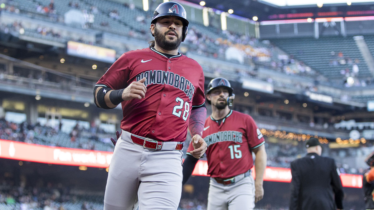 Arizona Diamondbacks third baseman Eugenio Suárez (28) and designated hitter Randal Grichuk (15) celebrate after scoring runs against the San Francisco Giants during the first inning