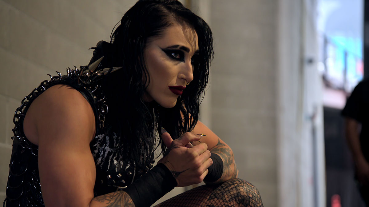 Rhea Ripley as seen in the Netflix series WWE: Unreal, which also features other Superstars like CM Punk.
