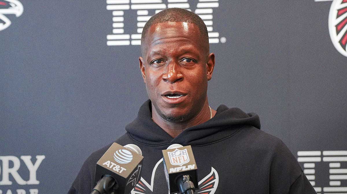 Atlanta Falcons head coach Raheem Morris addresses the media on the first day of practice during training camp at IBM Performance Field.