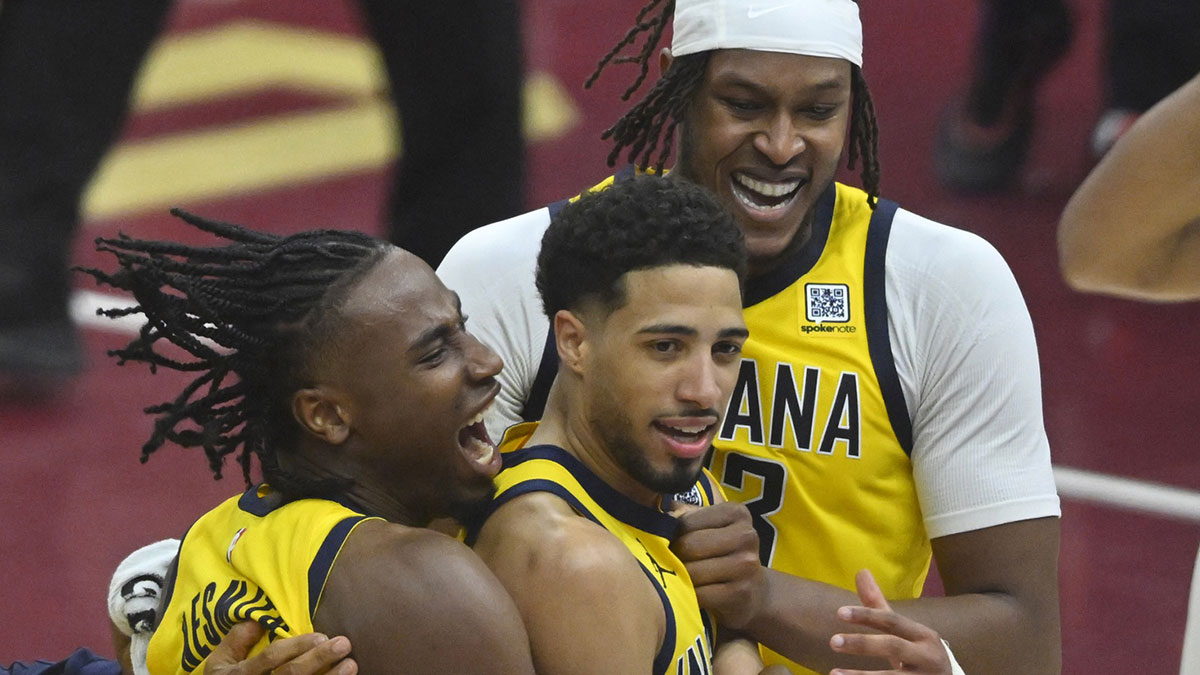 Indiana Pacers guard Tyrese Haliburton (center) celebrates the game-winning three-point basket with forward Aaron Nesmith (23) and center Myles Turner (33) after game two of the second round of the 2025 NBA Playoffs against the Cleveland Cavaliers at Rocket Arena.