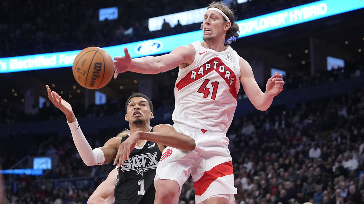 Toronto Raptors forward Kelly Olynyk (41) knocks a ball away from San Antonio Spurs center Victor Wembanyama (1) during the second half at Scotiabank Arena.