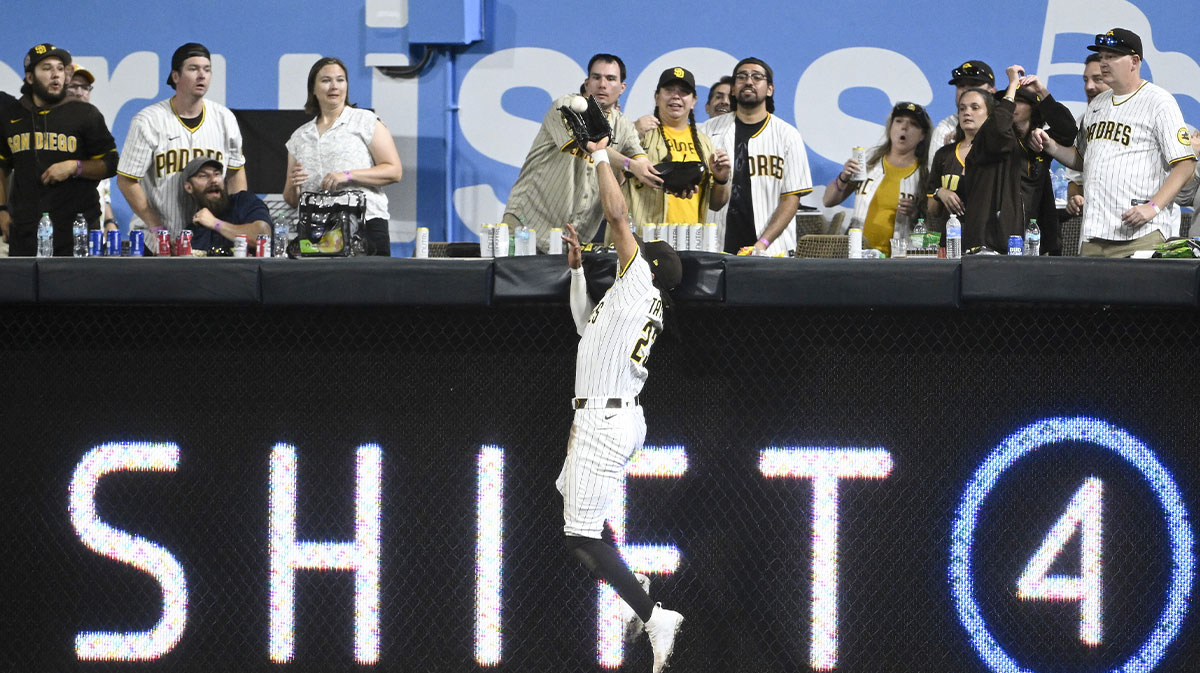 San Diego Padres right fielder Fernando Tatis Jr. (23) makes a catch at the wall on a hit by Arizona Diamondbacks first baseman Josh Naylor (22) during the eighth inning at Petco Park.