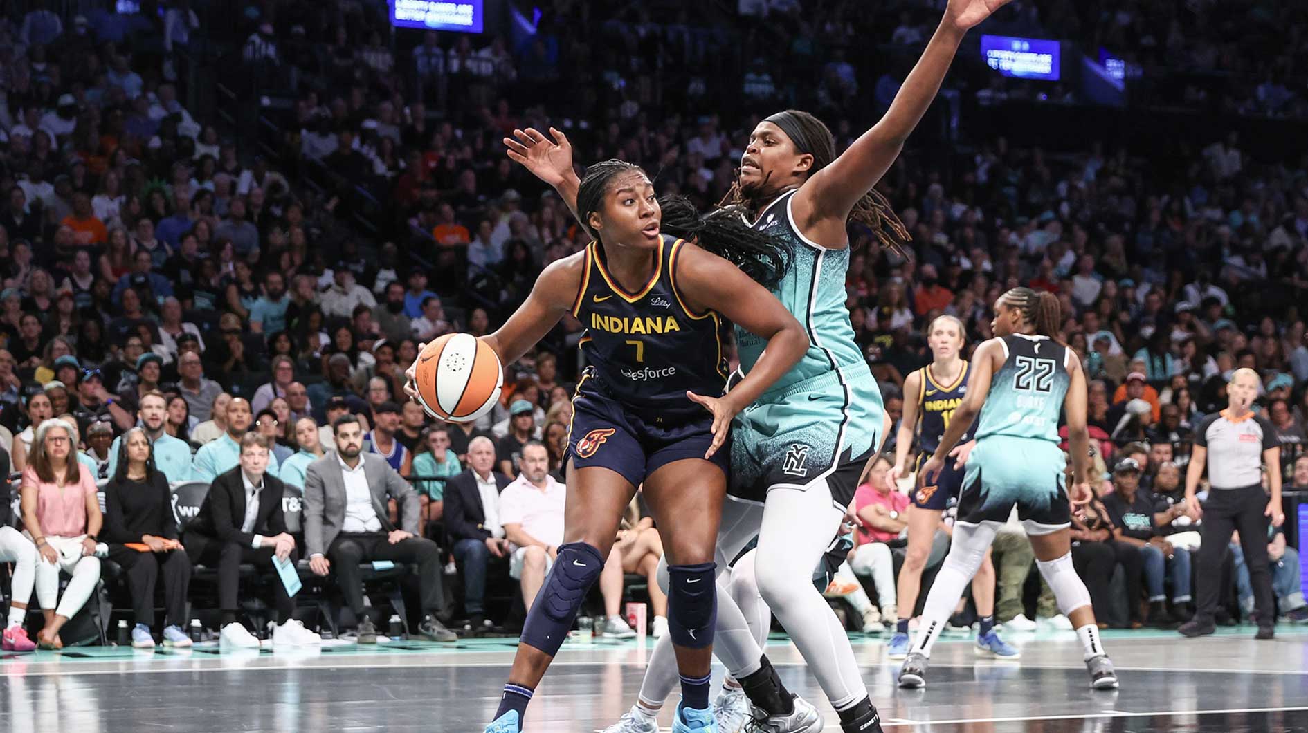 Fever forward Aliyah Boston (7) looks to post up