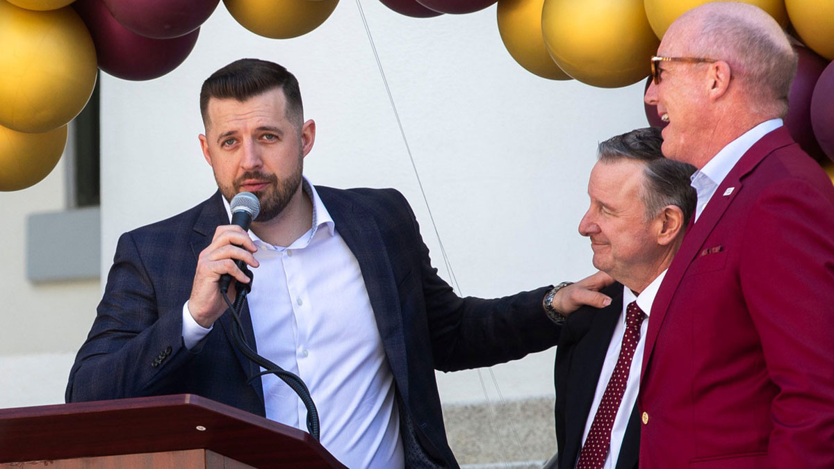 Florida State's new head basketball coach Luke Loucks expresses his gratitude to President Richard McCullough (middle) with FSU Board of Trustees member Peter Collins (right).