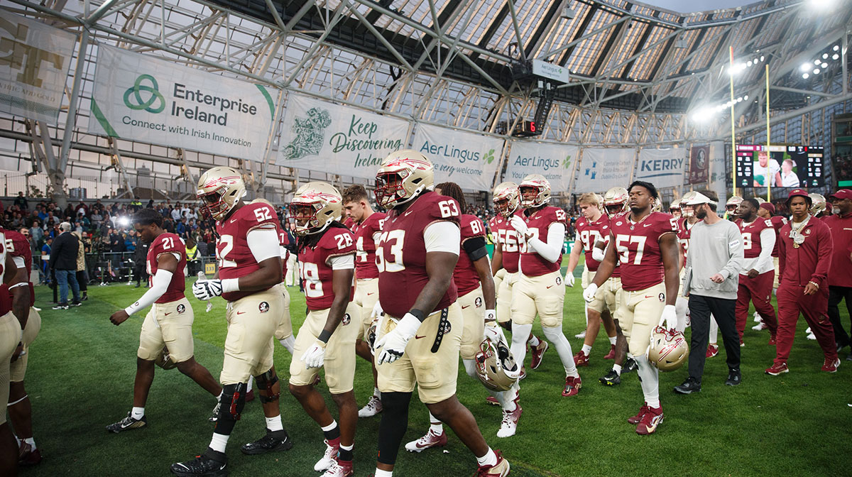 Florida State players walk off the field after their loss to Georgia Tech at Aviva Stadium.