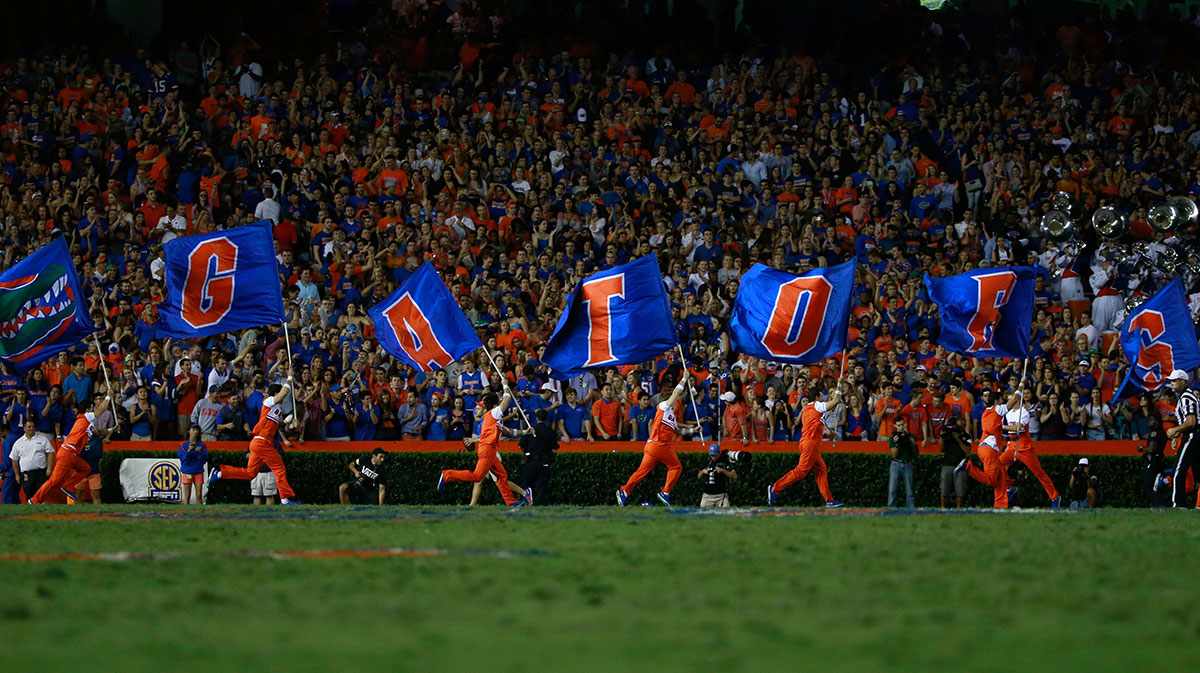 Florida Gators cheerleaders run flags across the goal line as they score against the Mississippi Rebels during the first half at Ben Hill Griffin Stadium.