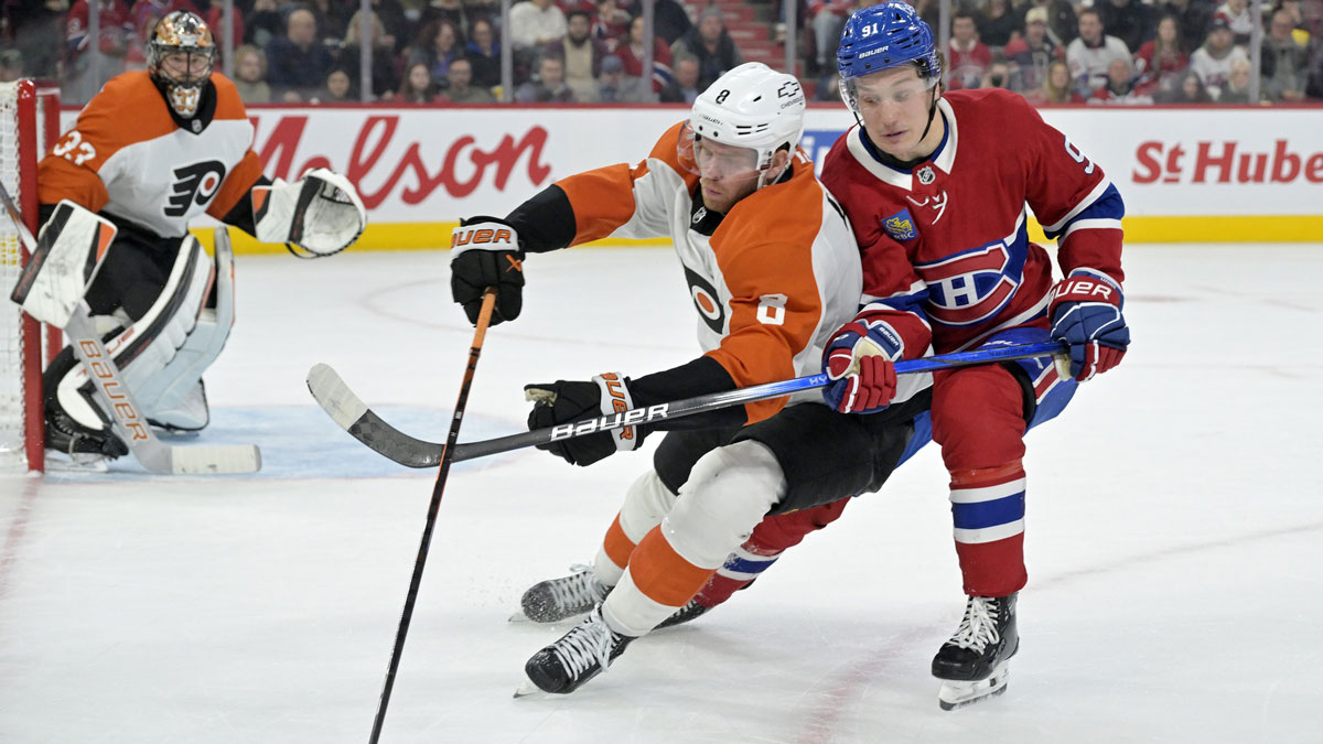 Philadelphia Flyers defenseman Cam York (8) plays the puck and Montreal Canadiens forward Oliver Kapanen (91) forechecks during the second period at the Bell Centre.