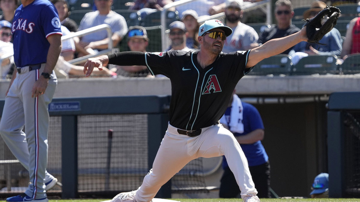 Arizona Diamondbacks first baseman Trey Mancini stretches for a throw against the Texas Rangers during Cactus League play at Salt River Fields on March 9, 2025. Lovullo Naylor