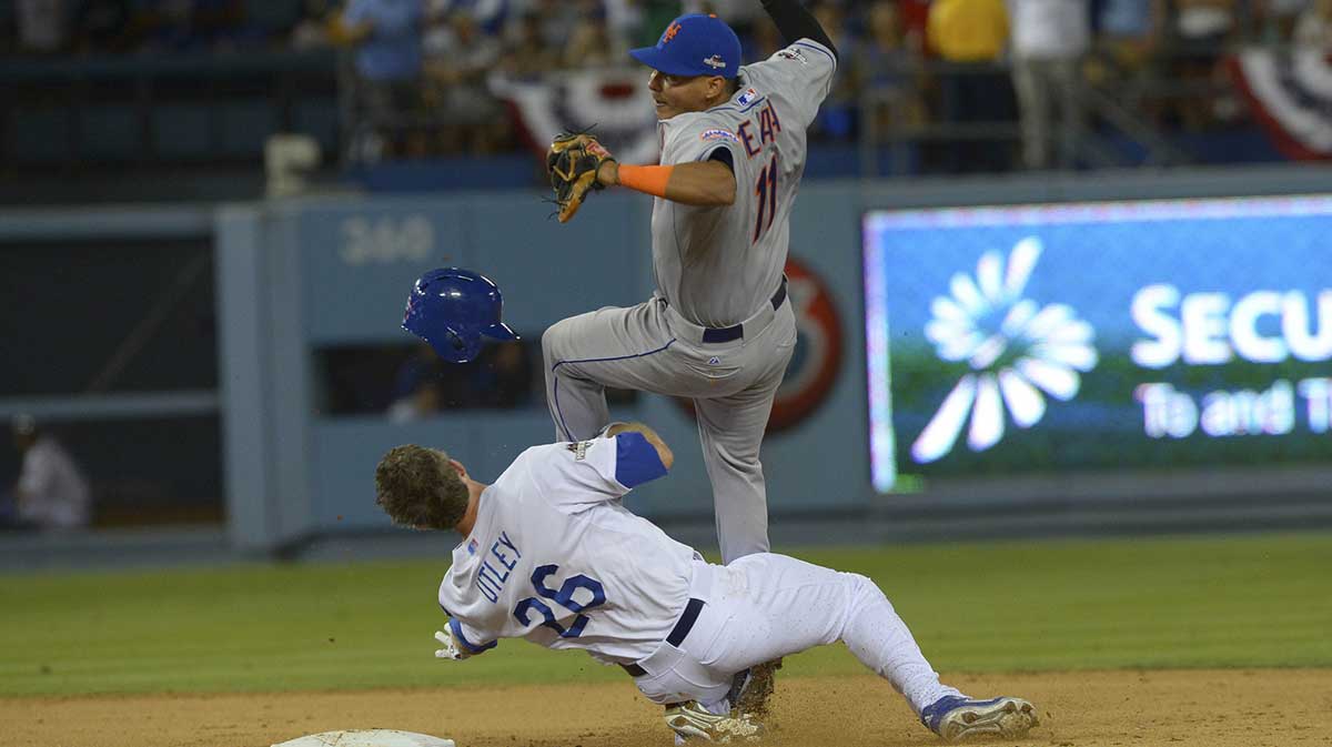 New York Mets shortstop Ruben Tejada (11) collides with Los Angeles Dodgers second baseman Chase Utley (26) at second base during the seventh inning in game two of the NLDS at Dodger Stadium. Mandatory Credit: Jayne Kamin-Oncea-Imagn Images