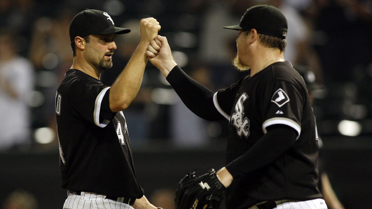 Chicago White Sox first baseman Paul Konerko (left) celebrates with relief pitcher Bobby Jenks (right) after defeating the Los Angeles Angels 5-2 at US Cellular Field.