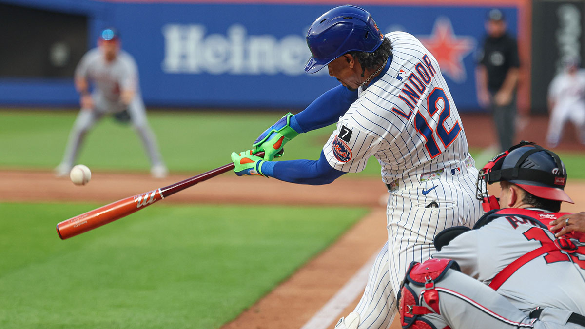 Jun 11, 2025; New York City, New York, USA; New York Mets shortstop Francisco Lindor (12) hits a double during the third inning against the Washington Nationals at Citi Field.