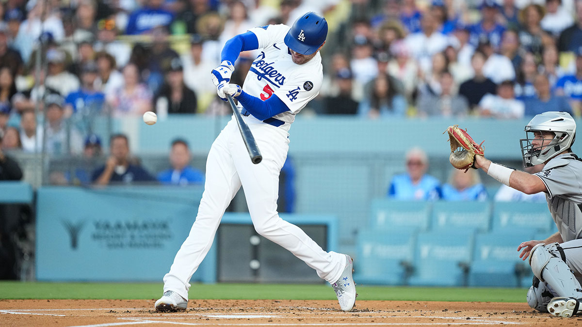 Jul 3, 2025; Los Angeles, California, USA; Los Angeles Dodgers first baseman Freddie Freeman (5) hits a double during the first inning against the Chicago White Sox at Dodger Stadium.