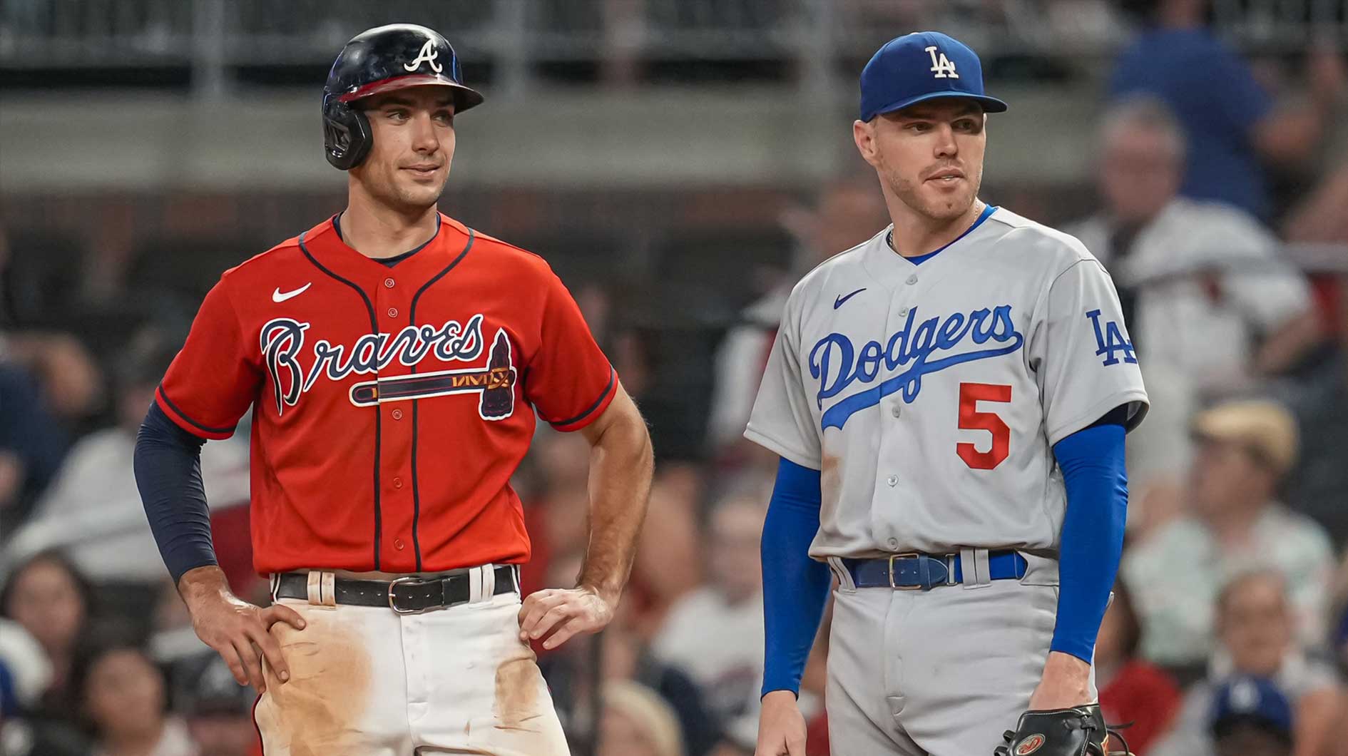 Atlanta Braves first baseman Matt Olson (28) on base next to Los Angeles Dodgers first baseman Freddie Freeman (5) during the ninth inning at Truist Park.