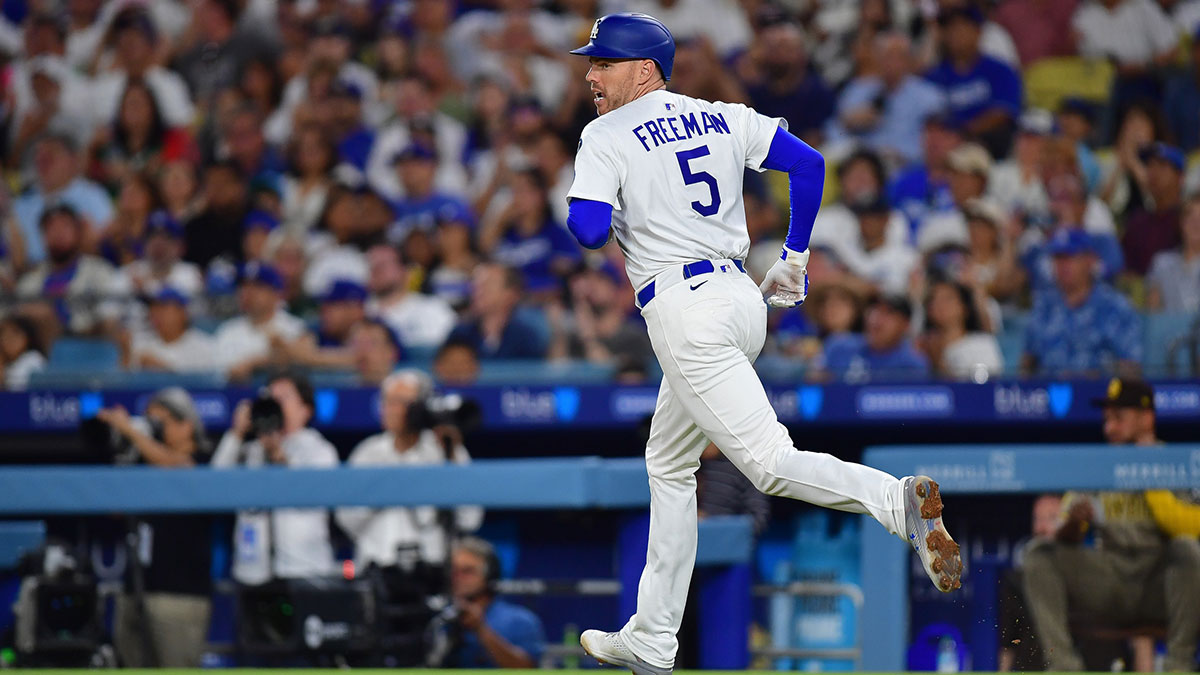 Jun 17, 2025; Los Angeles, California, USA; Los Angeles Dodgers first baseman Freddie Freeman (5) runs after hitting a single against the San Diego Padres during the sixth inning at Dodger Stadium. Mandatory Credit: Gary A. Vasquez-Imagn Images