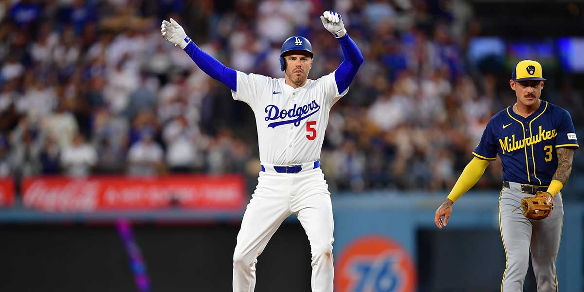 Los Angeles Dodgers first baseman Freddie Freeman (5) reaches second on a double against the Milwaukee Brewers during the fifth inning at Dodger Stadium.