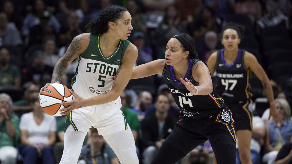 Seattle Storm forward Gabby Williams (5) controls the ball against Connecticut Sun guard Bria Hartley (14) during the second half at Climate Pledge Arena.