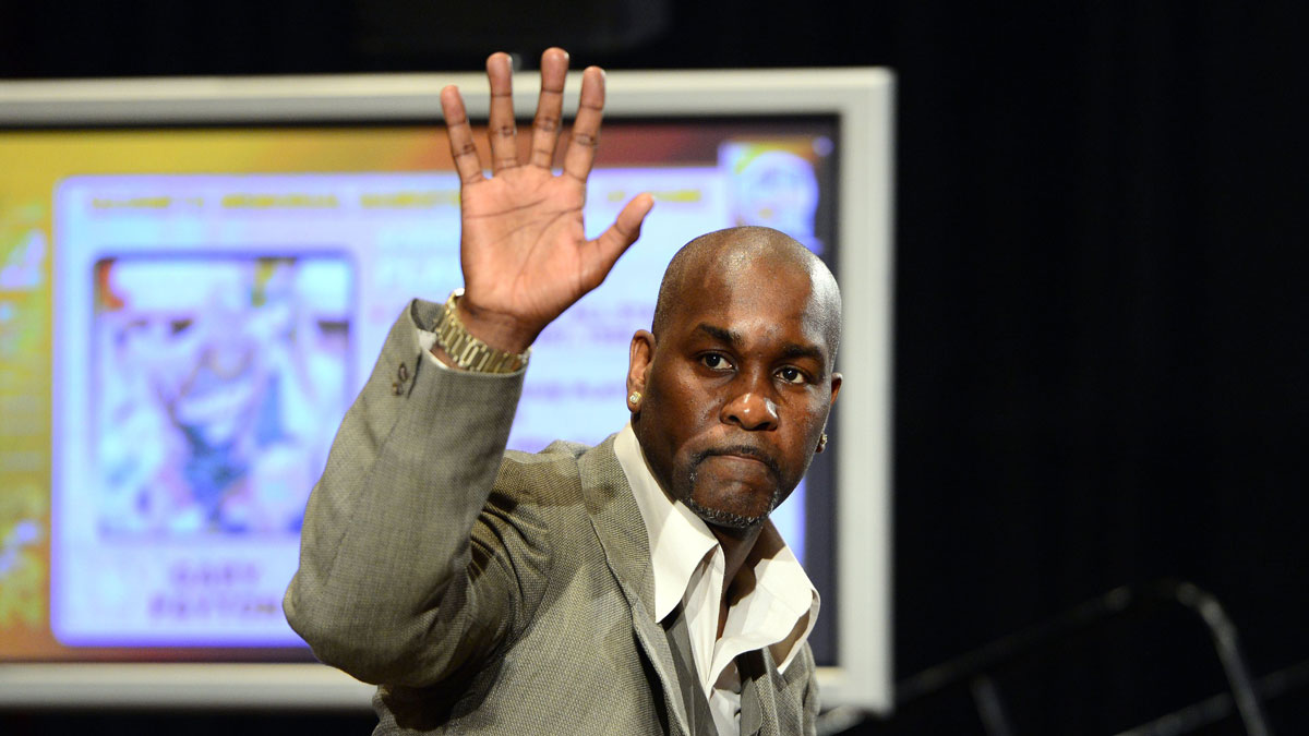 Gary Payton waves after being announced as a 2013 hall of fame finalist during a press conference at the Hilton Americas.