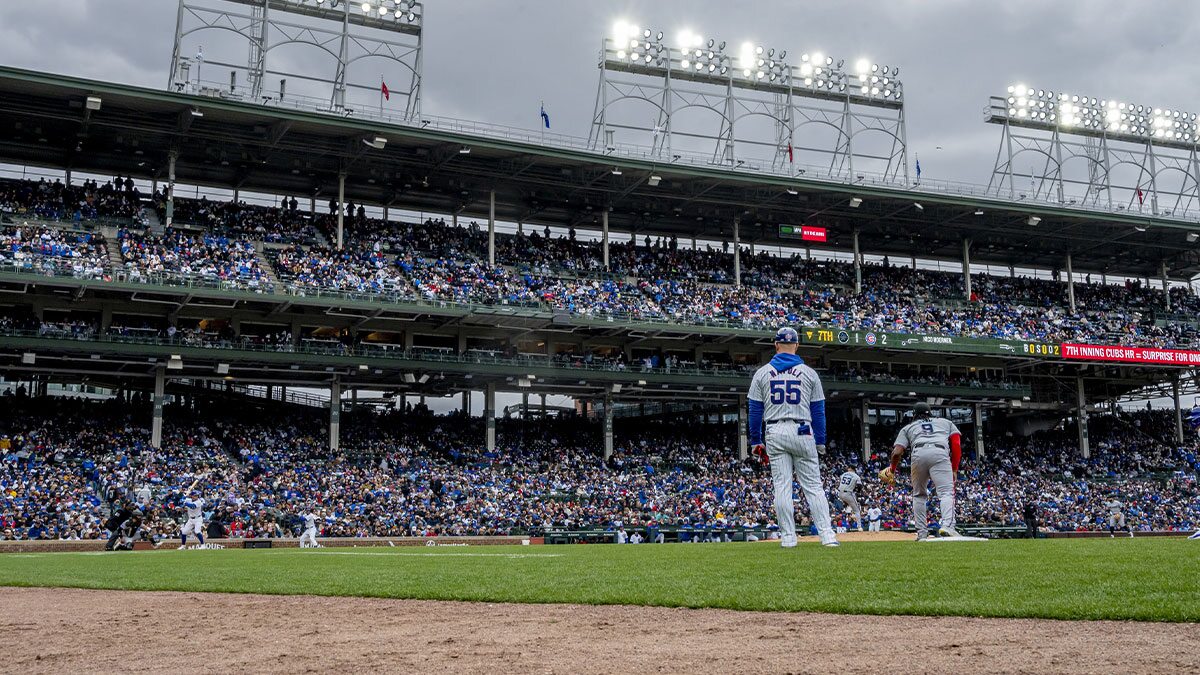 A wide angel general view of Miami Marlins pitcher Calvin Faucher (53) pitching to Chicago Cubs second baseman Nico Hoerner (2) during the seventh inning at Wrigley Field.