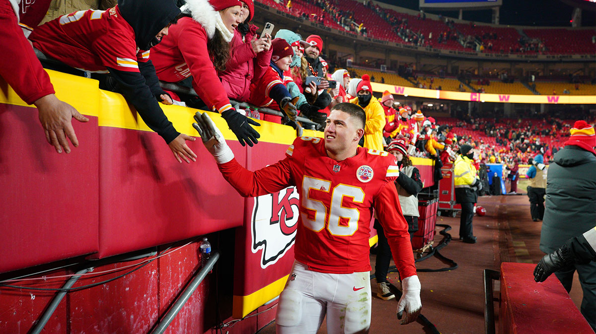 Kansas City Chiefs defensive end George Karlaftis (56) shakes hands with fans after defeating the Houston Texans in a 2025 AFC divisional round game at GEHA Field at Arrowhead Stadium.