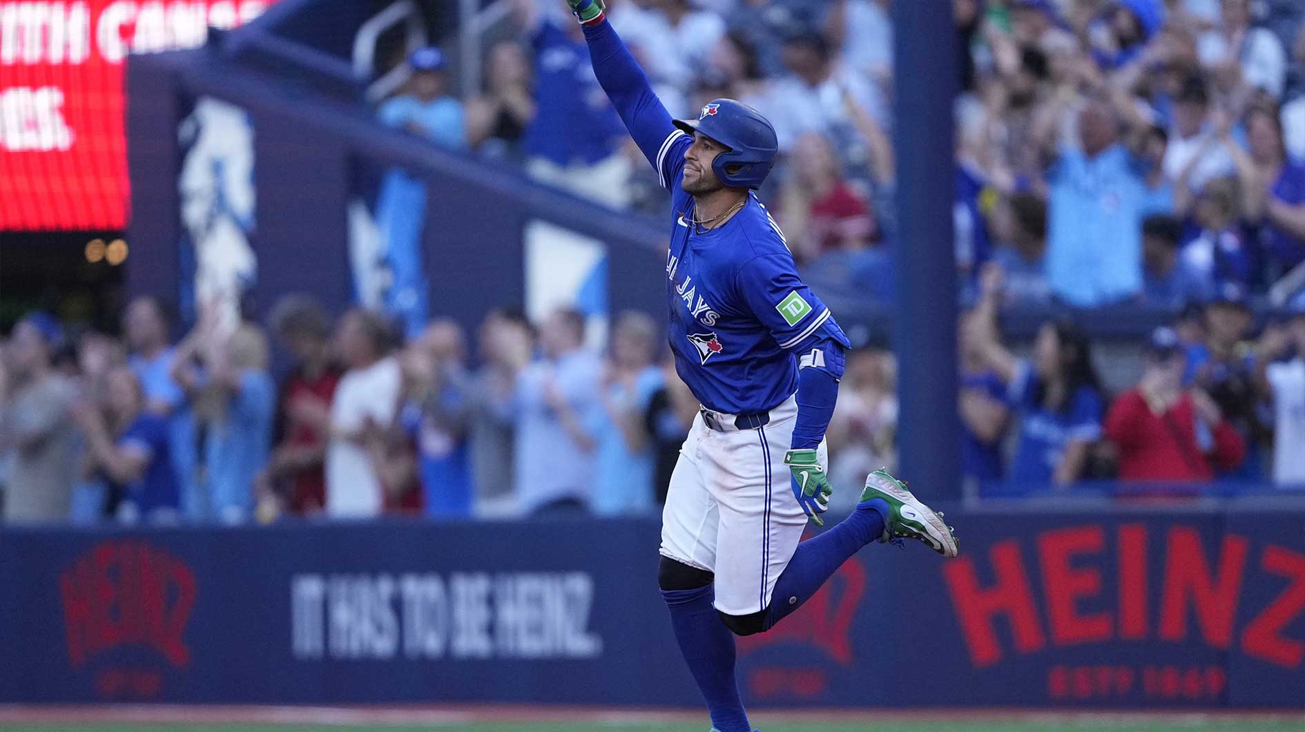 Toronto Blue Jays designated hitter George Springer (4) celebrates as he runs the bases on his two run home run against the New York Yankees during the third inning at Rogers Centre.