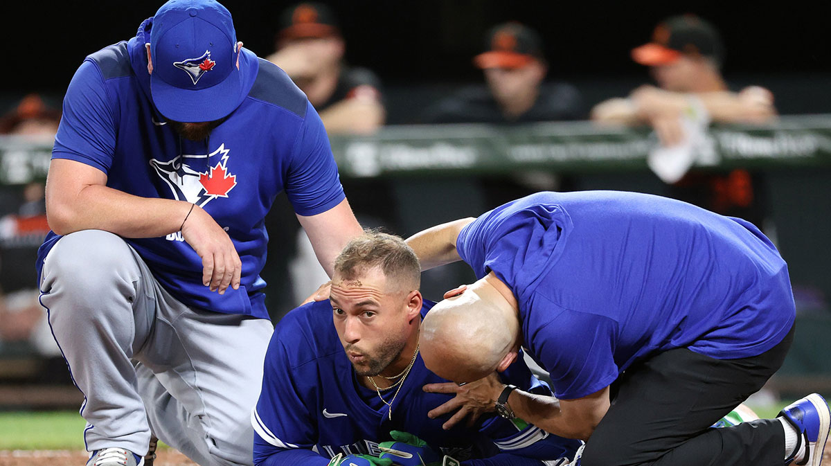 Toronto Blue Jays outfielder George Springer (4) gets hit by a pitch during the ninth inning against the Baltimore Orioles at Oriole Park at Camden Yards.