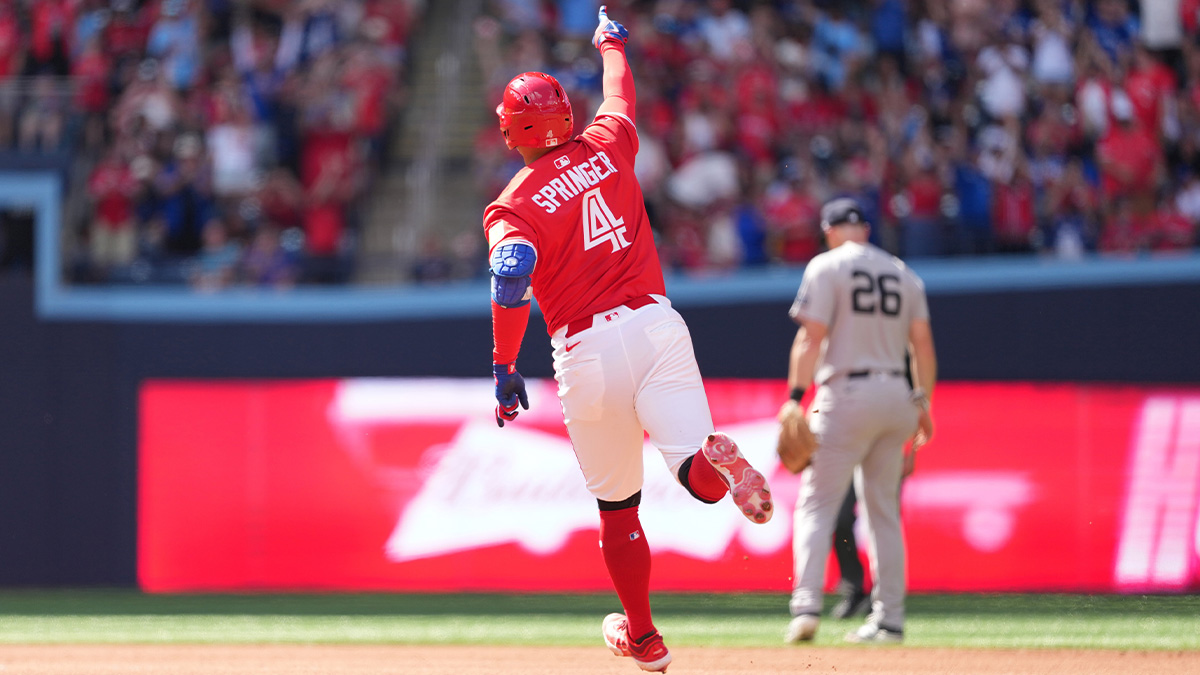 Toronto Blue Jays right fielder George Springer (4) runs the bases after hitting a home run against the New York Yankees during the fourth inning at Rogers Centre.